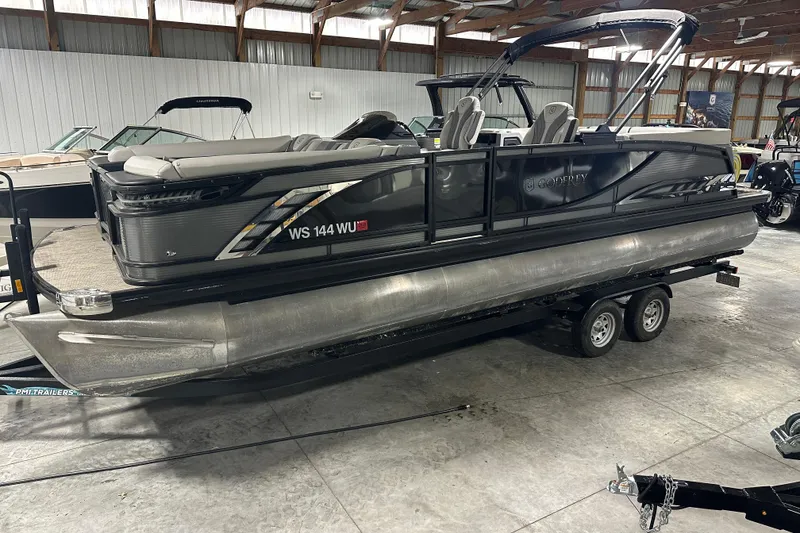 The Image of 2021 Godfrey Sanpan 2600 SBC pontoon boat on trailer in indoor storage. - 4