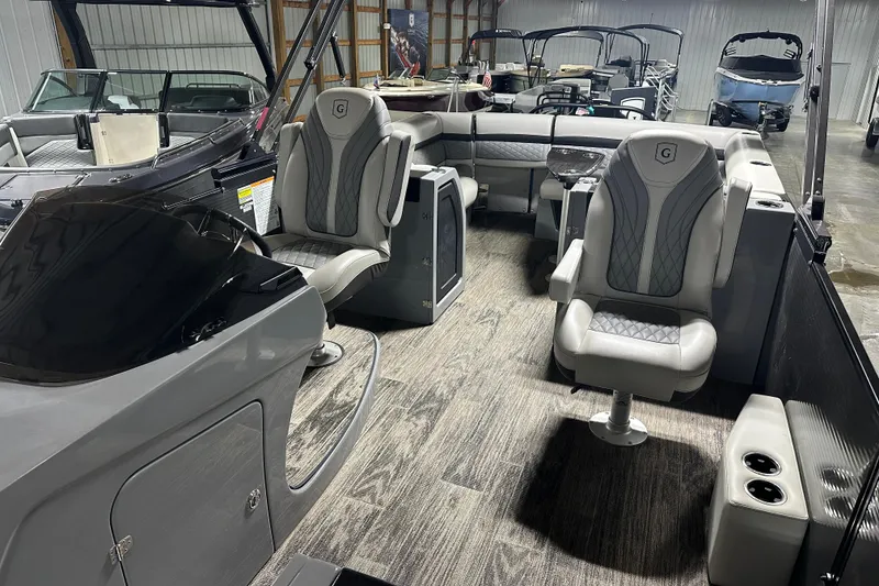 Slide: The Image of 2021 Godfrey Sanpan 2600 SBC pontoon boat interior with luxurious seating and modern design. - 7