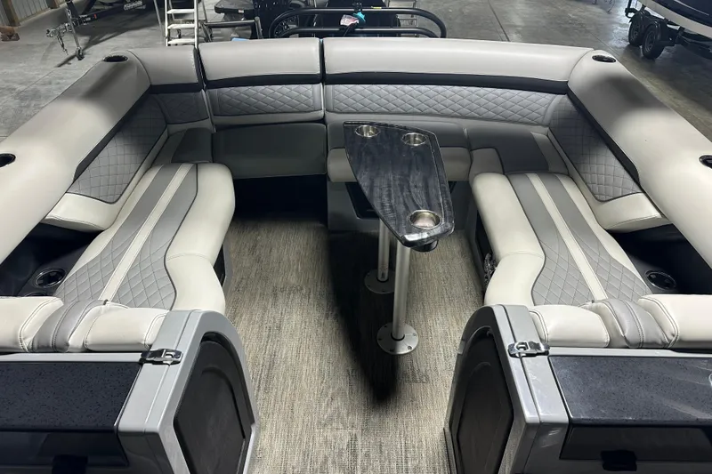 Slide: The Image of Luxurious interior of 2021 Godfrey Sanpan 2600 SBC pontoon boat with plush seating and table. - 8