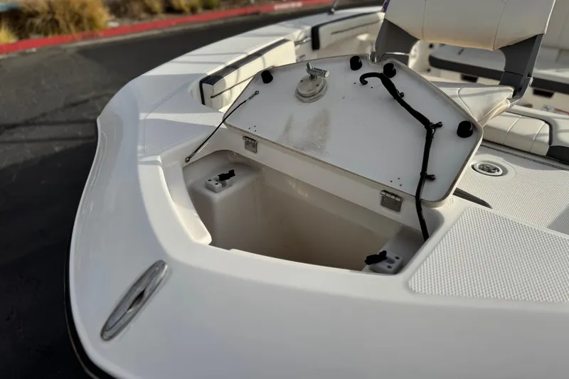 Slide: The Image of Open storage compartment on 2016 Yamaha Boats 190 FSH Deluxe, showcasing interior space. - 10