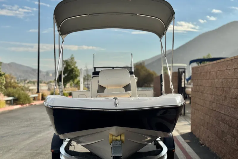 Slide: The Image of 2016 Yamaha Boats 190 FSH Deluxe on trailer, scenic mountain backdrop. - 2