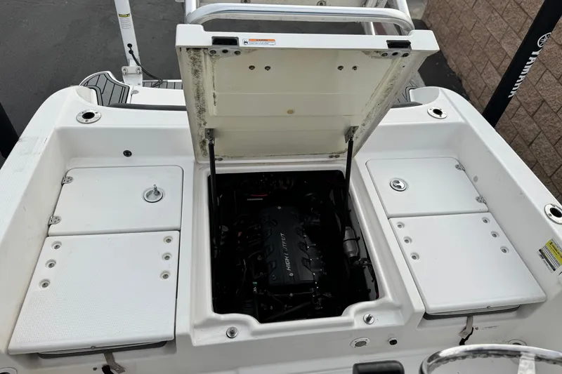 Slide: The Image of 2016 Yamaha Boats 190 FSH Deluxe engine compartment with open hatch. - 23