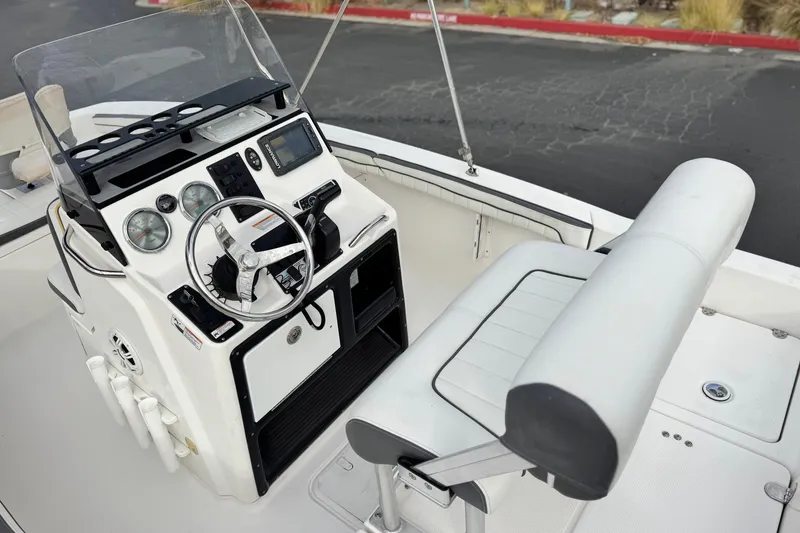 Slide: The Image of 2016 Yamaha Boats 190 FSH Deluxe cockpit with steering wheel and controls. - 29