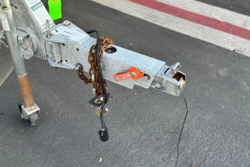 Slide: The Image of Trailer hitch of a 2016 Yamaha Boats 190 FSH Deluxe on asphalt. - 34