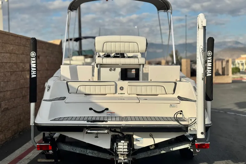 Slide: The Image of 2016 Yamaha Boats 190 FSH Deluxe on trailer, rear view, outdoor setting. - 4