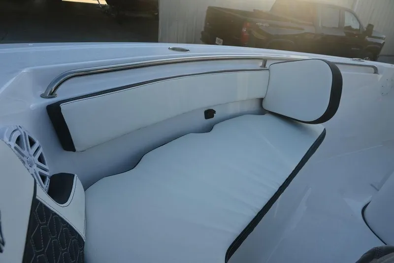 Slide: The Image of 2026 Tidewater 210 LXF boat interior with white cushioned seating and stainless steel railing. - 21