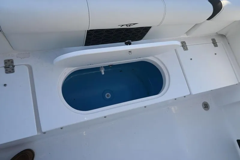 Slide: The Image of 2026 Tidewater 210 LXF boat interior with open storage compartment. - 8