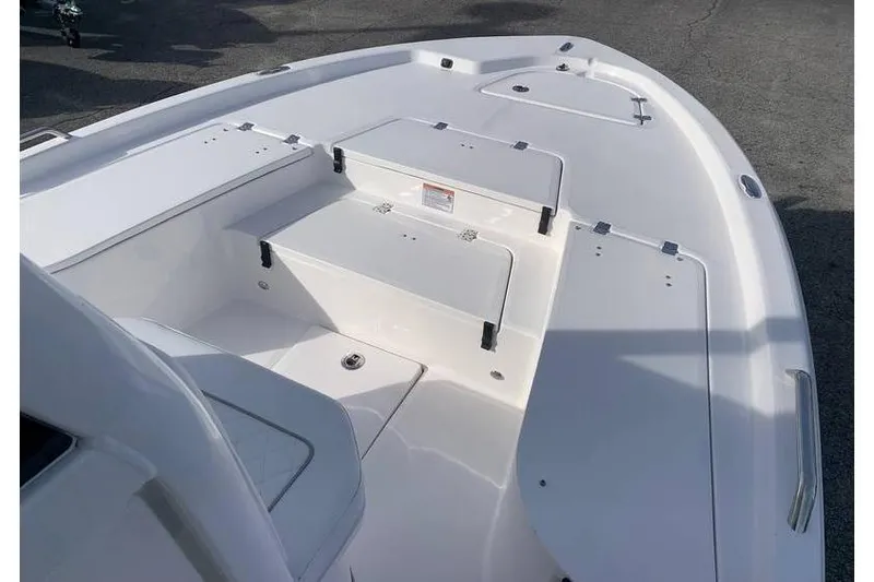 Slide: The Image of 2024 Sea Fox 231 Bay Fox boat deck with storage compartments and seating. - 14