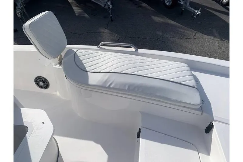 Slide: The Image of 2024 Sea Fox 231 Bay Fox boat with white cushioned seating and backrest. - 17