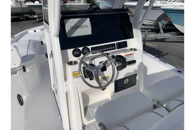 Slide: The Image of 2024 Sea Fox 231 Bay Fox boat cockpit with Garmin navigation system. - 18