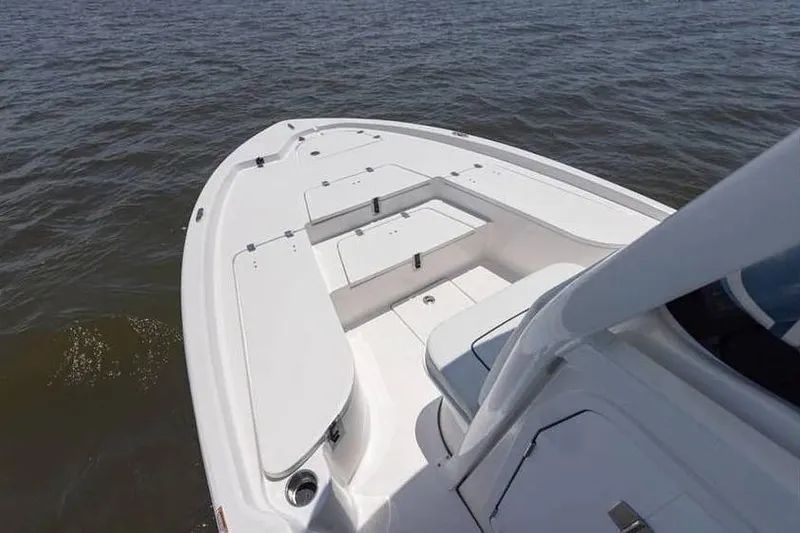 Slide: The Image of 2024 Sea Fox 231 Bay Fox boat deck on calm water. - 7