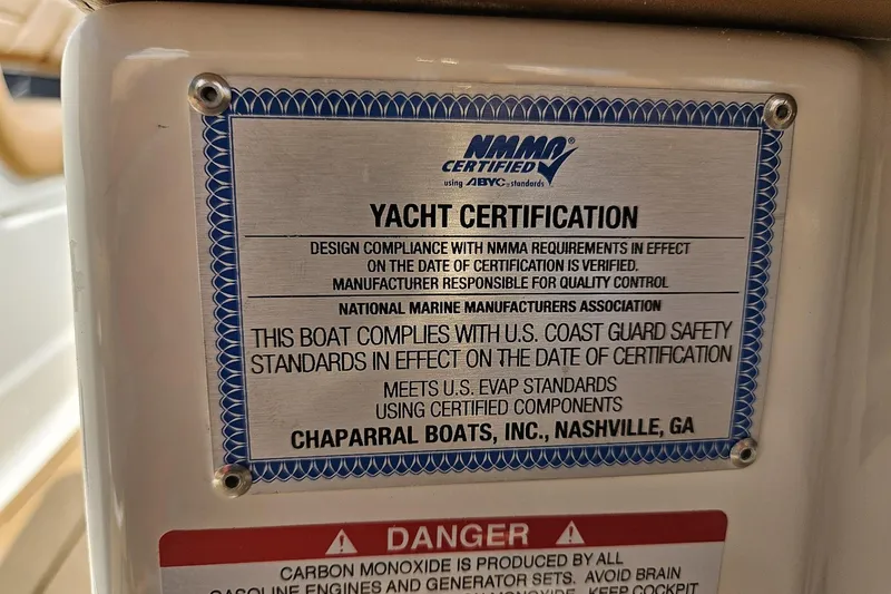 Slide: The Image of 2025 Chaparral 267 SSX yacht certification plaque, NMMA and U.S. Coast Guard compliance. - 15