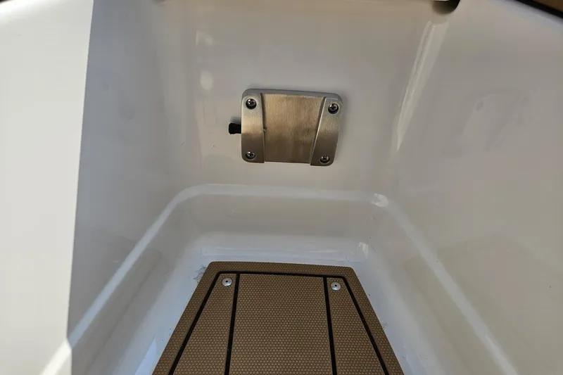 Slide: The Image of 2025 Chaparral 267 SSX boat interior detail with stainless steel fixture and textured flooring. - 18