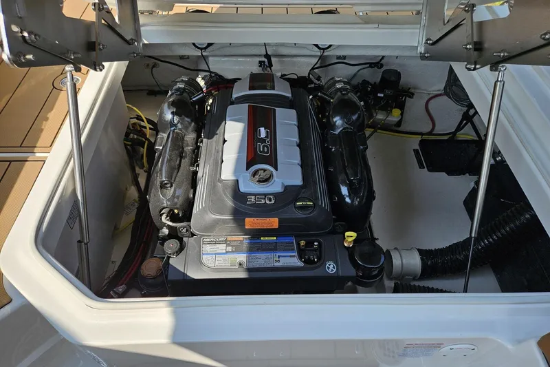 Slide: The Image of Engine compartment of 2025 Chaparral 267 SSX boat, featuring a powerful 6.2L engine. - 26