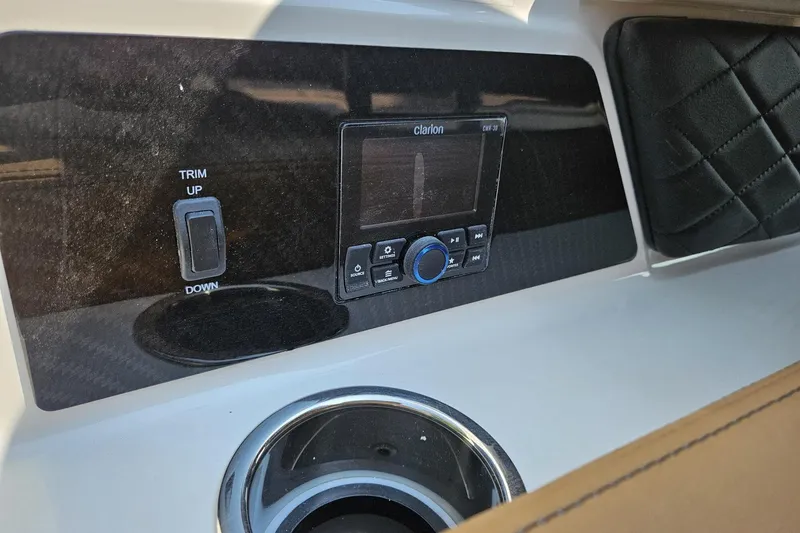 Slide: The Image of 2025 Chaparral 267 SSX dashboard with Clarion stereo and trim control. - 27