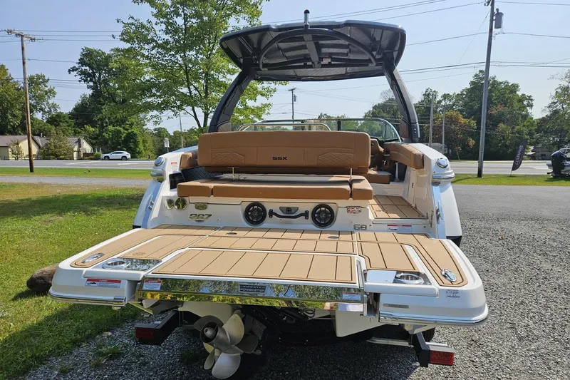 Slide: The Image of 2025 Chaparral 267 SSX boat rear view with swim platform and seating. - 3