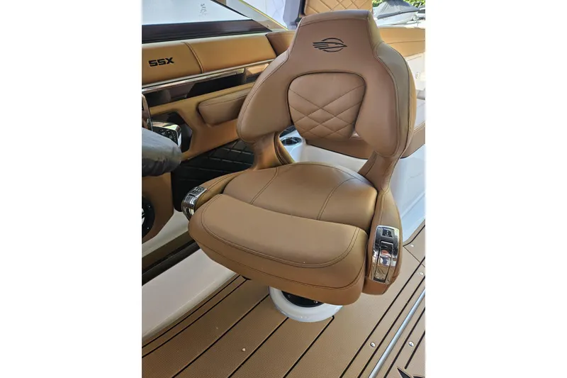 Slide: The Image of Luxurious tan leather seat in 2025 Chaparral 267 SSX boat interior. - 35