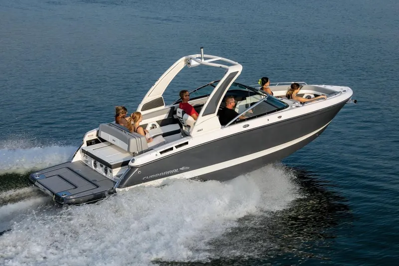 Slide: The Image of Manufacturer Provided Image: 2025 Chaparral 267 SSX boat cruising on water with passengers enjoying the ride. - 44