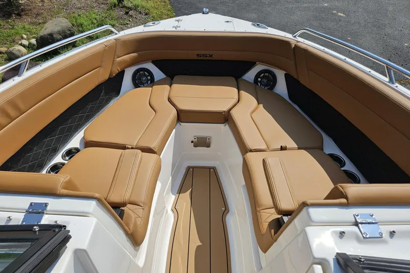Slide: The Image of 2025 Chaparral 267 SSX boat interior with tan leather seating and modern design. - 8