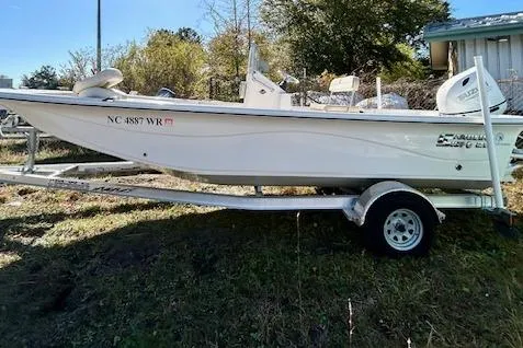 Slide: The Image of 2023 Carolina Skiff 21 LS boat on trailer, parked outdoors. - 17