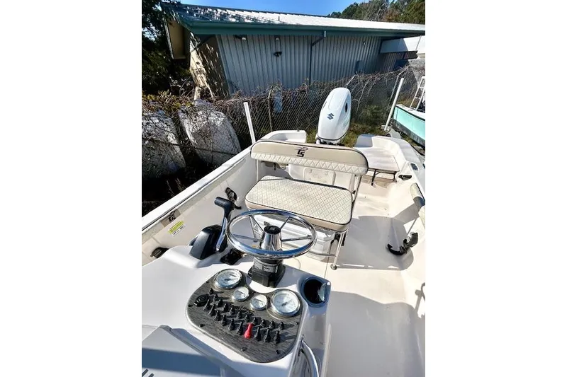 Slide: The Image of 2023 Carolina Skiff 21 LS boat interior with steering console and seating. - 19