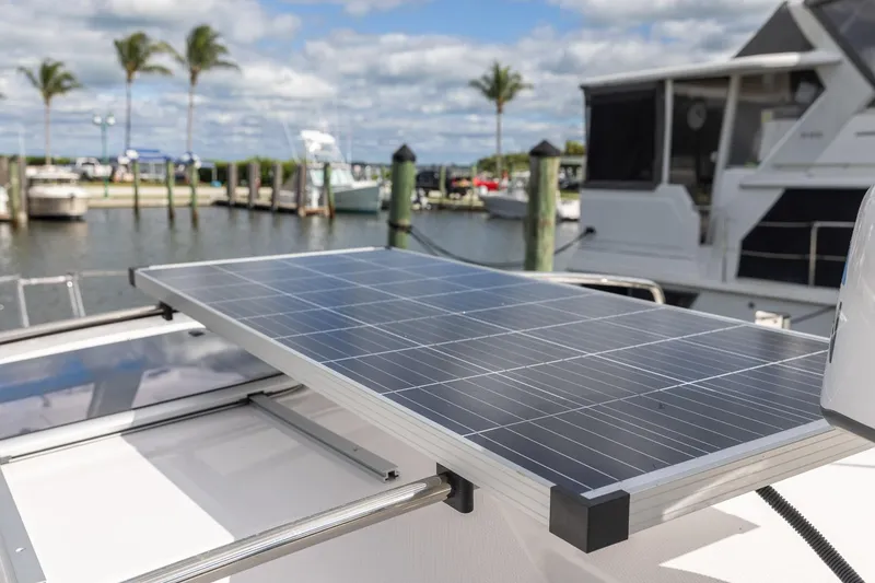 Slide: The Image of 2025 Cutwater C-288 Coupe LE with solar panel, docked at marina. - 14
