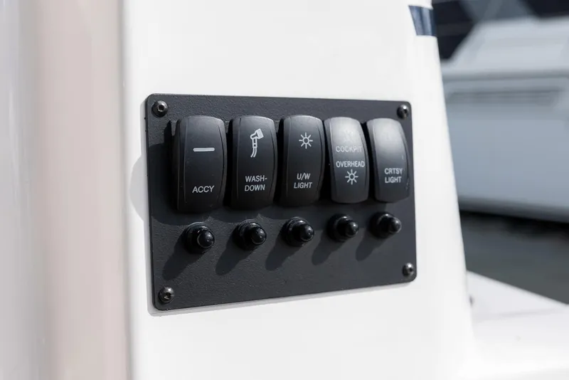 Slide: The Image of Control panel on 2025 Cutwater C-288 Coupe LE boat with labeled switches. - 16