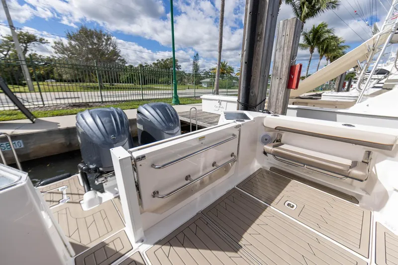 Slide: The Image of 2025 Cutwater C-288 Coupe LE boat deck with dual engines and seating. - 8