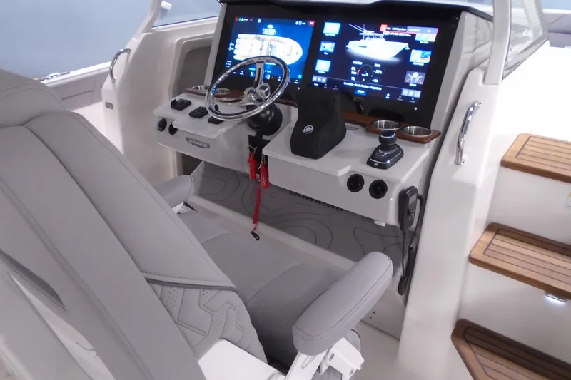 Slide: The Image of 2026 Regal 38 SAV boat cockpit with modern controls and digital display. - 20