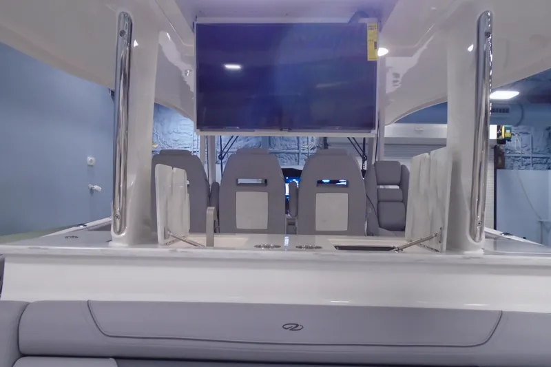 Slide: The Image of 2026 Regal 38 SAV boat interior with seating and mounted screen. - 29