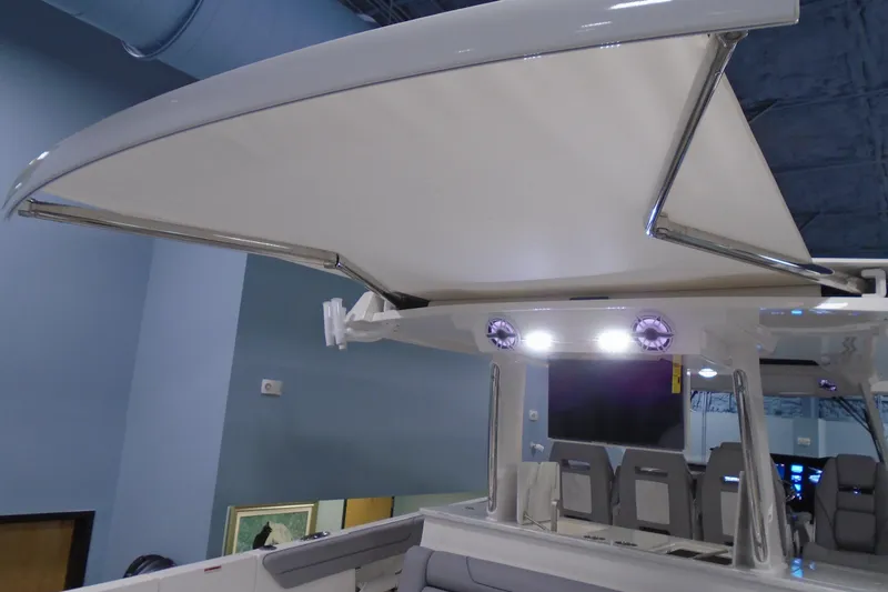 Slide: The Image of 2026 Regal 38 SAV boat with retractable canopy and modern seating. - 33