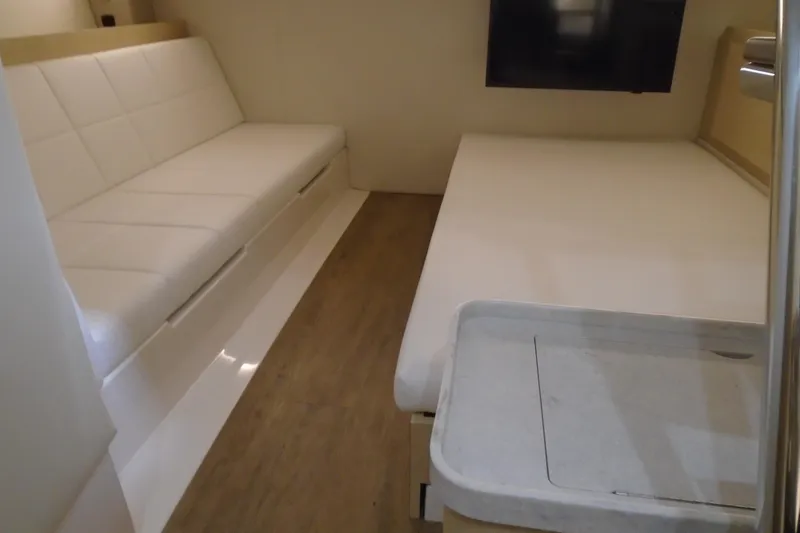 Slide: The Image of Interior of 2026 Regal 38 SAV yacht with modern seating and wooden flooring. - 34