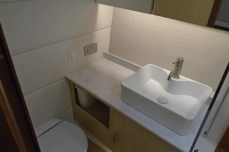 Slide: The Image of Modern bathroom interior of 2026 Regal 38 SAV yacht with sleek sink and countertop. - 38