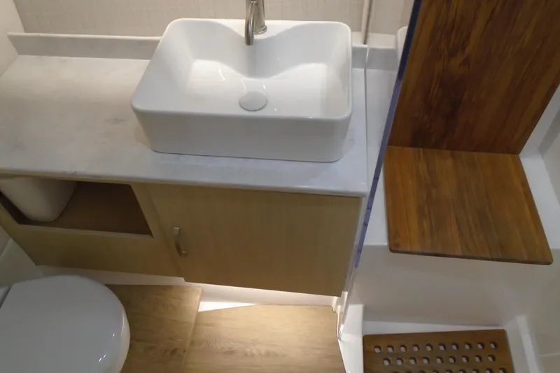 Slide: The Image of Modern bathroom interior in 2026 Regal 38 SAV yacht with sink and wooden accents. - 40