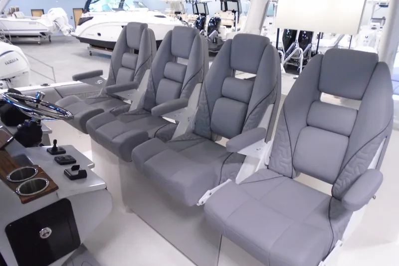 Slide: The Image of 2026 Regal 38 SAV boat interior with four luxurious gray seats. - 41