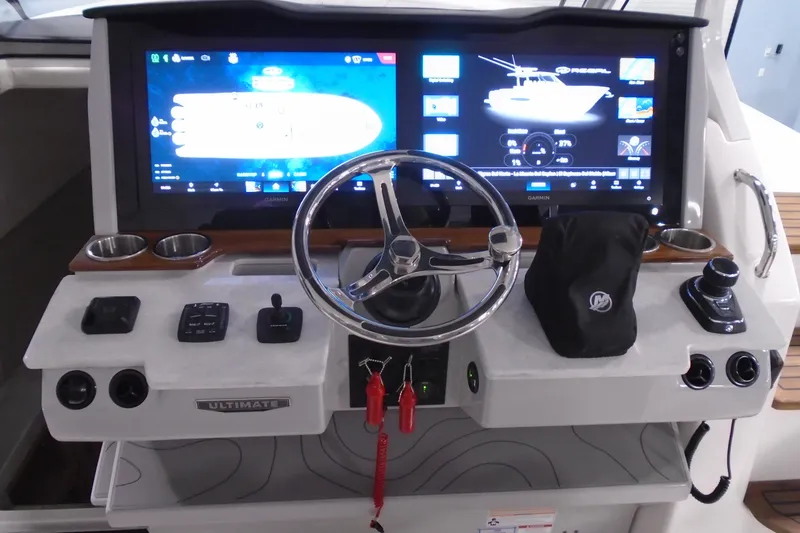 Slide: The Image of Cockpit of 2026 Regal 38 SAV boat with advanced navigation displays and controls. - 42