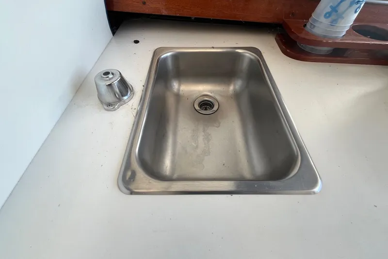 Slide: The Image of Stainless steel sink on 1984 Skiff Craft 26 Runabout boat interior. - 17