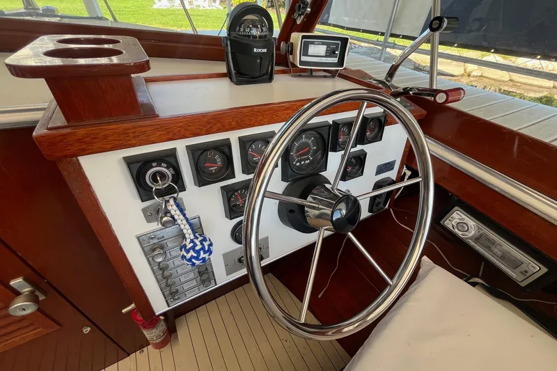 Slide: The Image of 1984 Skiff Craft 26 Runabout dashboard with steering wheel and gauges. - 19