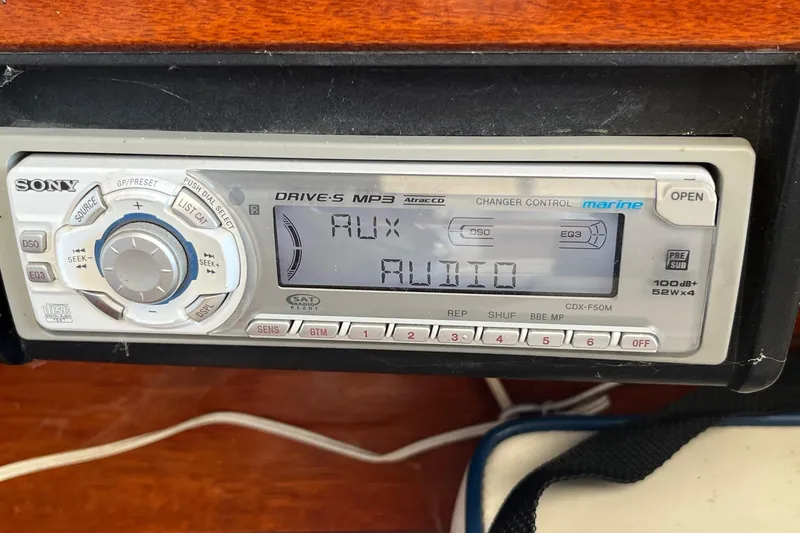 Slide: The Image of Sony marine stereo system displaying "AUX AUDIO" in a 1984 Skiff Craft 26 Runabout. - 20