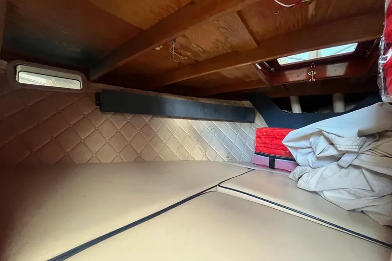 Slide: The Image of Interior cabin of 1984 Skiff Craft 26 Runabout with quilted walls and wooden ceiling. - 23