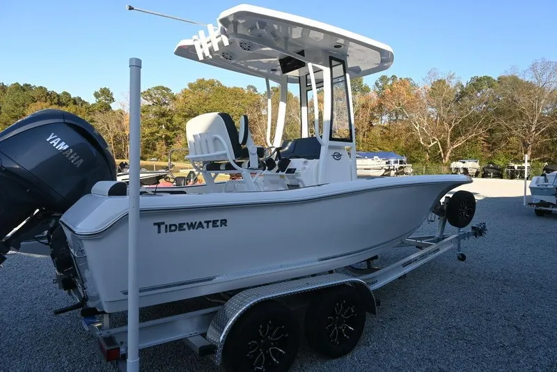 Slide: The Image of 2026 Tidewater 198 CC Adventure boat on trailer, featuring Yamaha engine, parked outdoors. - 2