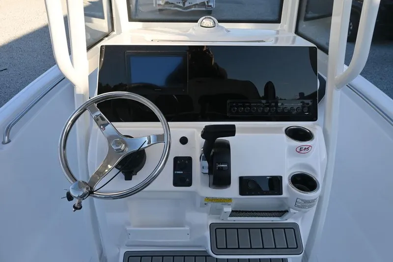 Slide: The Image of 2026 Tidewater 198 CC Adventure boat console with steering wheel and controls. - 3