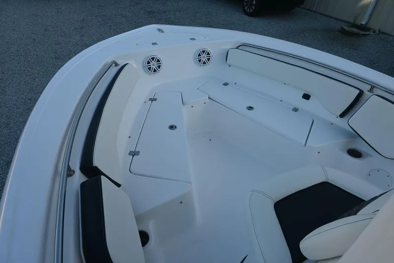 Slide: The Image of 2026 Tidewater 198 CC Adventure boat interior with white seating and storage compartments. - 5