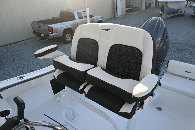 Slide: The Image of 2026 Tidewater 198 CC Adventure boat seats with black and white upholstery. - 8