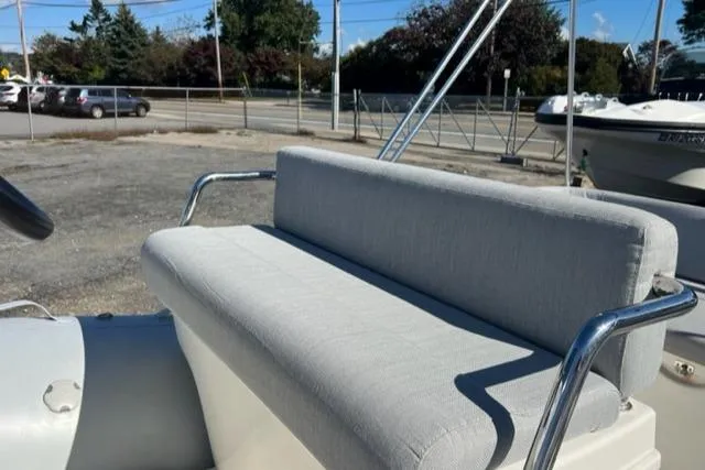 Slide: The Image of 2023 Zodiac N-ZO 680 boat seat with gray upholstery and metal armrests. - 9