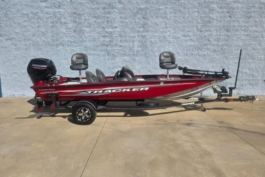 The Image of 2020 Tracker Pro Team 175 TXW Tournament Edition boat on trailer, red color, side view. - 1