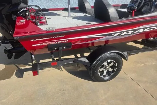 Slide: The Image of 2020 Tracker Pro Team 175 TXW Tournament Edition boat on trailer, red and black design. - 10