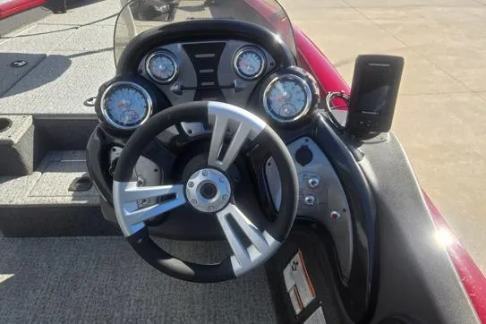 Slide: The Image of 2020 Tracker Pro Team 175 TXW Tournament Edition boat dashboard with steering wheel and gauges. - 7