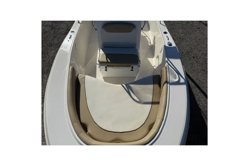 Slide: The Image of 2016 Pioneer 180 Islander boat interior with cushioned seating and storage. - 11