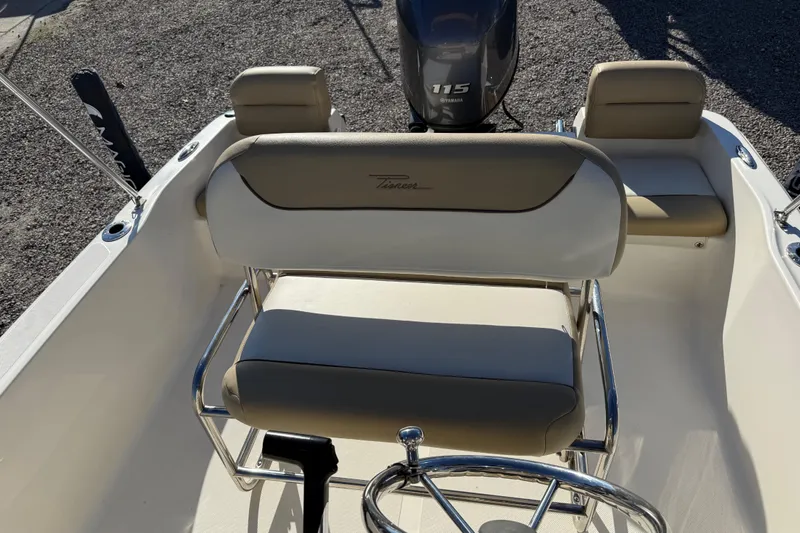 Slide: The Image of 2016 Pioneer 180 Islander boat interior with seating and Yamaha 115 engine. - 12